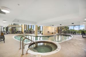 a large indoor pool with a hot tub in a building at 701 Holiday Isle 701 in Dauphin Island