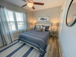a bedroom with a bed and a ceiling fan at 078 Lazy Bass in Dauphin Island