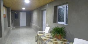 a dining room with a table and a window at LeoSani in Lagodekhi