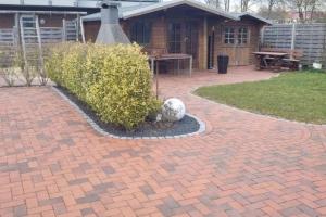 a soccer ball is sitting on a brick patio at Fewo Voßeler in Büsum