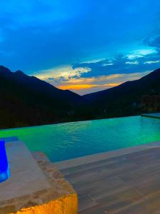 a swimming pool with a view of the mountains at Gîte A Funtana in Manso