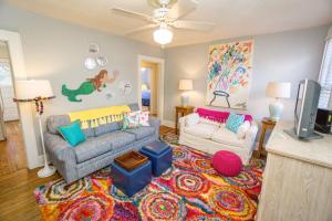 a living room with two couches and a tv at Graduations Welcome! Bayside Bungalow Close Proximity to Downtown Beaufort and Parris Island in Beaufort