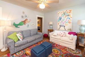 a living room with a couch and a table at Graduations Welcome! Bayside Bungalow Close Proximity to Downtown Beaufort and Parris Island in Beaufort