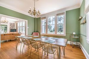 a dining room with a table and chairs at Historic Home Overlooking the Beaufort River Located on Bay St - Sleeps 10 in Beaufort