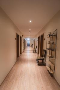 an empty hallway with chairs and shelves in a building at Hotel Studlagil in Skjöldólfsstaðir +70 photos