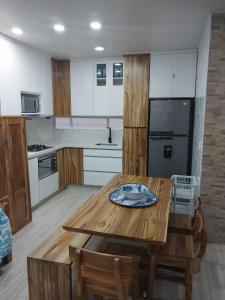 a kitchen with a wooden table with a plate on it at Espectacular cabaña en Coveñas - Sucre, Frente al mar!!! in Coveñas