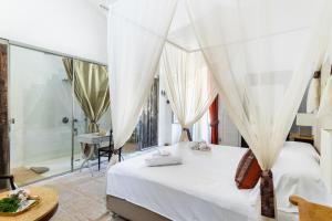 Кровать или кровати в номере Masseria Costanza Vendicari