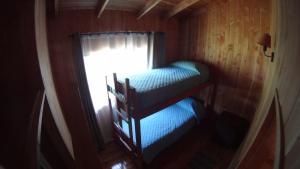 Postel nebo postele na pokoji v ubytování Los arrayanes de huife