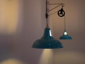 two green lights hanging from a wall at The Smugglers Rest in Woolacombe