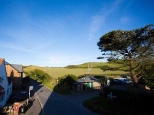 an overhead view of a town with a tree and a street at The Smugglers Rest in Woolacombe