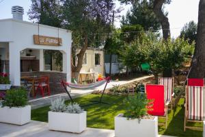 a house with a hammock in the yard at Casina Anna Maria in Francavilla Fontana