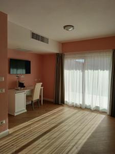 Et tv og/eller underholdning på RMaison Luxury Suites Olbia