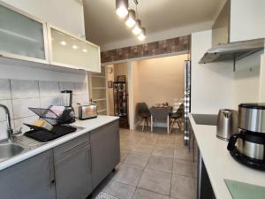 a kitchen with a sink and a counter at Toul superbe appartement plein centre in Toul