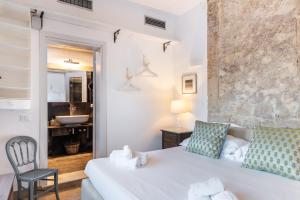 Кровать или кровати в номере Masseria Costanza Vendicari