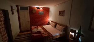 Voodi või voodid majutusasutuse Leela Cottages toas