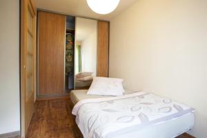Posteľ alebo postele v izbe v ubytovaní Apartament Na Górskiej