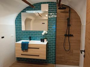 a bathroom with a sink and a shower at Berghof Reiter in Weissbriach