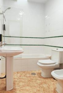 a bathroom with a white toilet and a sink at Pita 3, San Jose, Nijar in San José