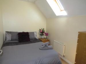 a bedroom with a large bed in a room at Bradford Drive in Mile End