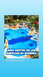 a sign for a water park at a resort at Hotel Tierra Santa in Santa Fe de Antioquia