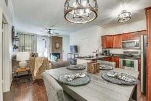 a kitchen and living room with a dining room table at Scottsdale Condo with Fireplace and Community Pools! in Scottsdale