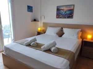Posteľ alebo postele v izbe v ubytovaní Coral Villas