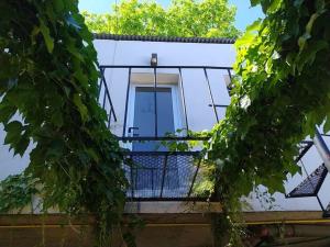 a building with a balcony with a window at depto muy cómodo en 1er piso in La Plata