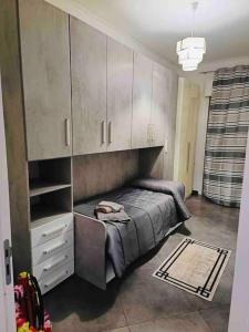 a bedroom with a bed and cabinets in it at Stella Apartment in Palermo