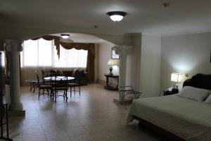 Cama ou camas em um quarto em Hotel Parador