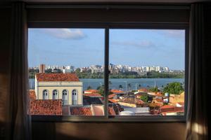 a view of a city from a window at Hotel e Hostel da Fonte in São Luís