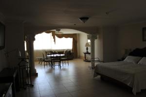Cama ou camas em um quarto em Hotel Parador