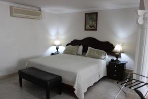 Cama ou camas em um quarto em Hotel Parador
