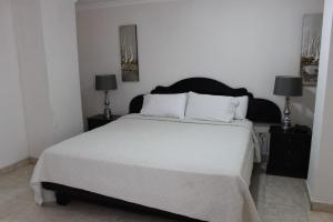 Cama ou camas em um quarto em Hotel Parador
