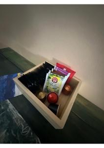 a drawer with some food in it on a bed at Appartamenti Sud Ovest By MountainHouses in Sestriere