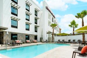 a swimming pool in front of a hotel at Hampton Inn & Suites - Napa, CA in Napa