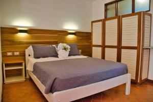 Postel nebo postele na pokoji v ubytování Samara Pacific Lodge