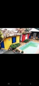 a picture of a house and a swimming pool at HostelAmaréStar Sempremovimento in Rio de Janeiro