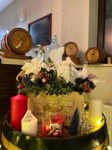a table with a candle and christmas decorations on it at Hotel Nosal Ski & Wine in Zakopane