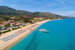 an aerial view of a beach with a boat in the water at Villa Olga in Katelios