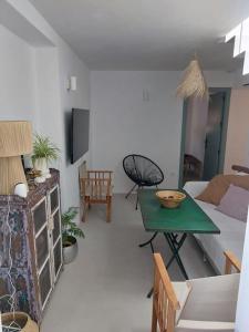 a living room with a couch and a table at La Niña de Vejer in Vejer de la Frontera
