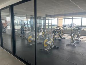 a row of exercise bikes in a gym at Stella Maris Vista de Cima in Salvador