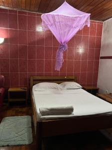 Postel nebo postele na pokoji v ubytování Elitineide Guest House