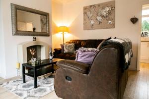 a living room with a couch and a table at Elite 49 Stays in Newcastle upon Tyne
