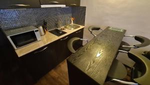 Kuchyň nebo kuchyňský kout v ubytování New Gudauri Apartment