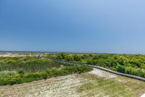 an aerial view of a dirt road in a field at Ocean Front D-Building - POOL ACCESS AND OCEAN VIEWS!!! in Harbor Island