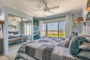 a bedroom with a bed and a view of the ocean at Ocean Front D-Building - POOL ACCESS AND OCEAN VIEWS!!! in Harbor Island
