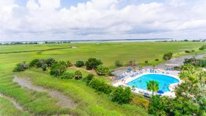 an overhead view of a swimming pool in a field at Ocean Front D-Building - POOL ACCESS AND OCEAN VIEWS!!! in Harbor Island