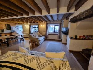 a large living room with a couch and a table at Cosy Cottage in Edern, Morfa Nefyn, Golf, Near Ty Coch in Ederyn