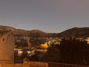 a view of a town at night with mountains at Casa San Antonio in Albarracín