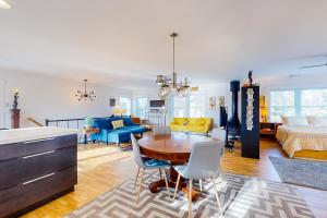 a living room with a table and a bedroom at Rehoboth Beach --- 35526 Dry Brook Dr in Rehoboth Beach